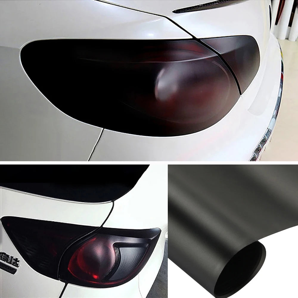 Close-up view of a matte smoke vinyl wrap film applied to a car's headlight and taillight.