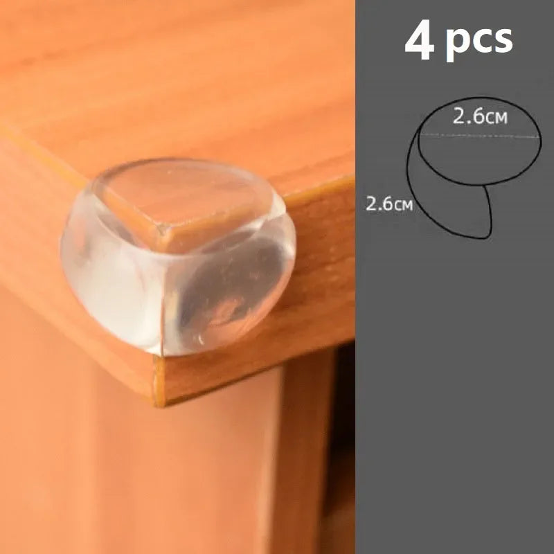 Four silicone corner edge guards used to protect baby safety on a wooden surface.