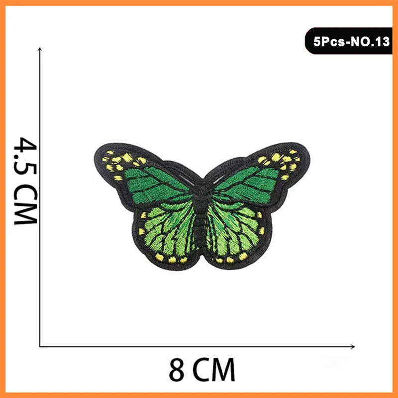 Five embroidered butterfly iron-on patches with green wings and yellow accents.