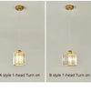 Two pendant lights, A style and B style, featuring crystal glass shades and brass hardware, mounted on a wall.