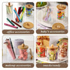 A collection of various office accessories, baby accessories, makeup items, and snacks/candy displayed in clear acrylic apoth