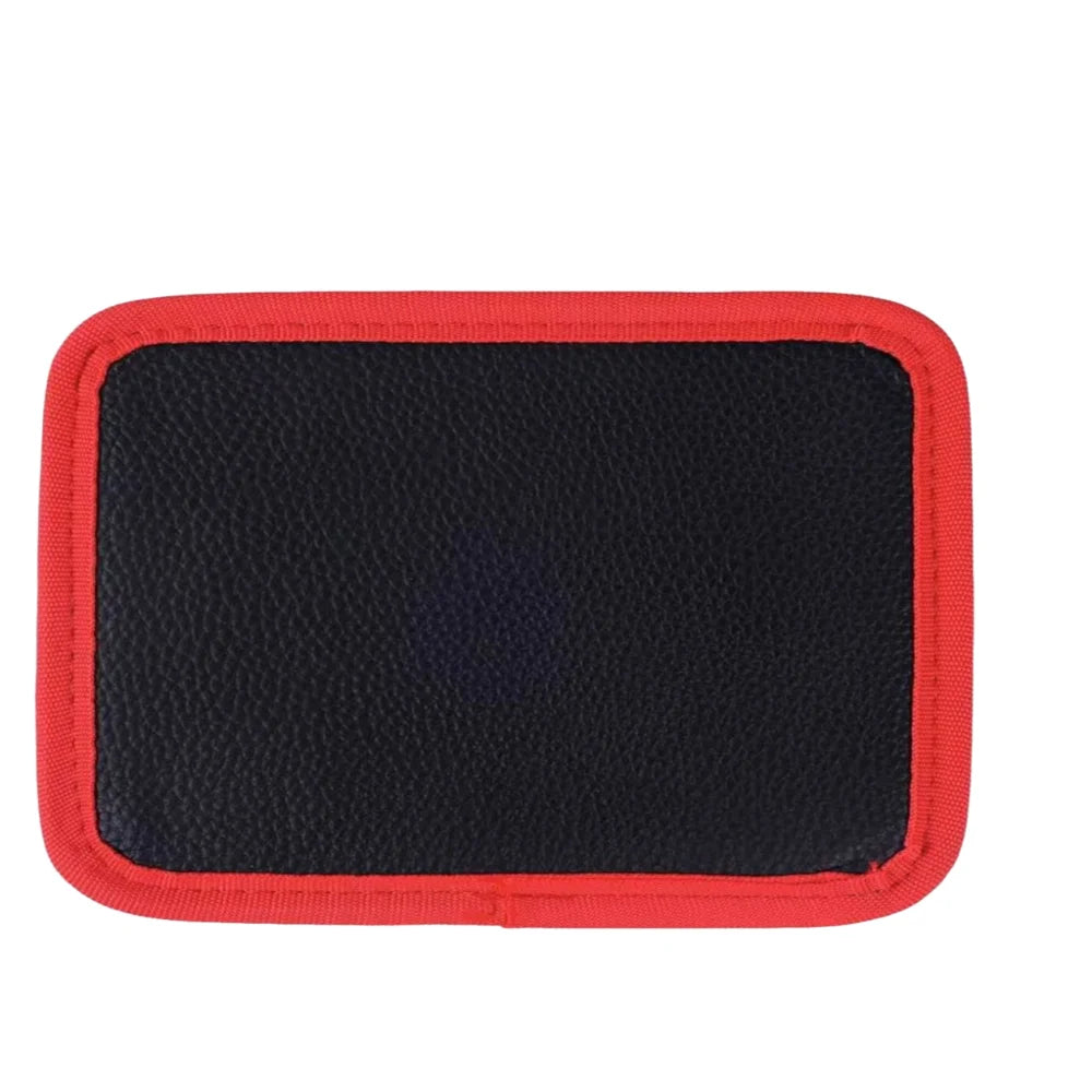 A black magnetic tool mat with a red border.