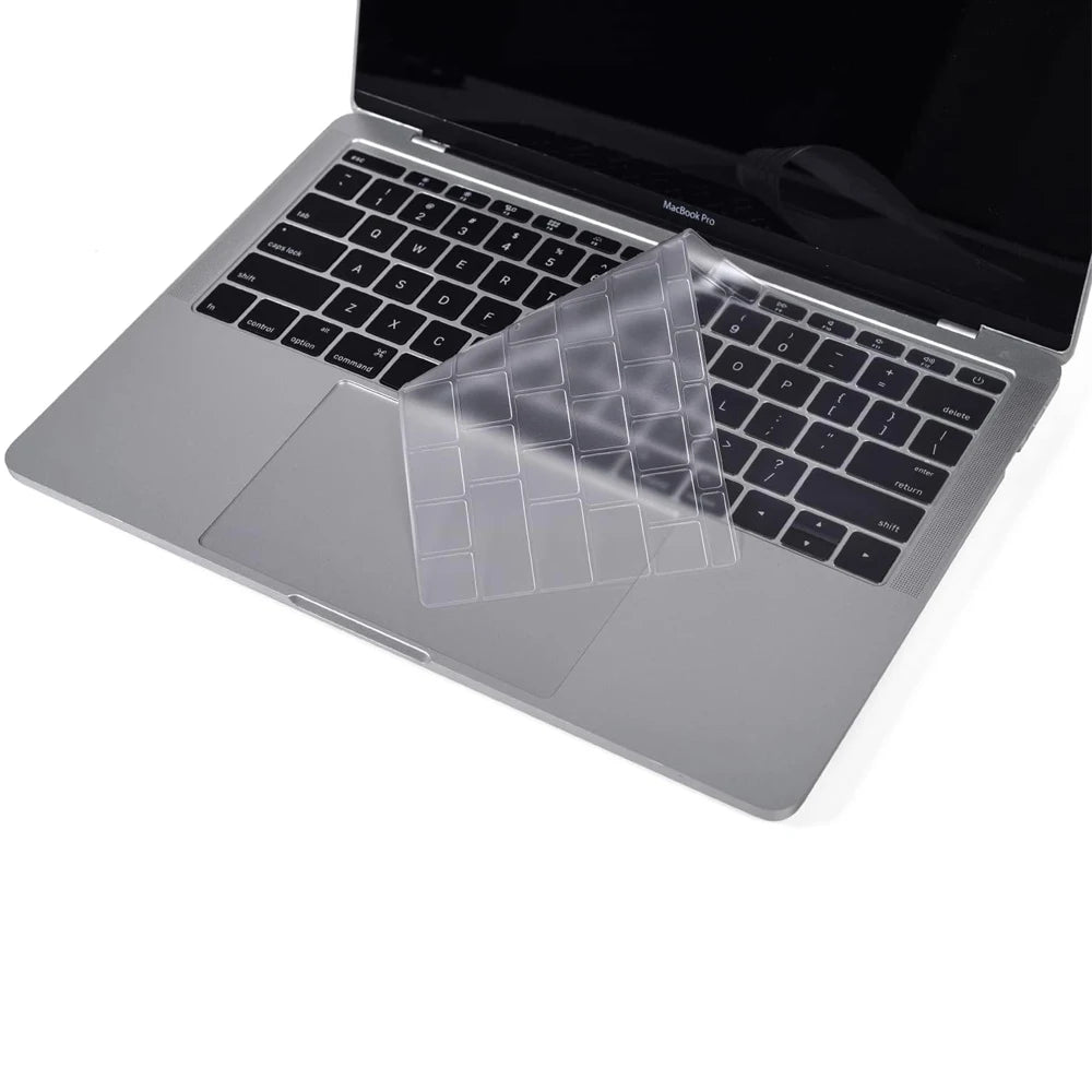 A clear TPU keyboard cover is placed on a closed MacBook Pro laptop.