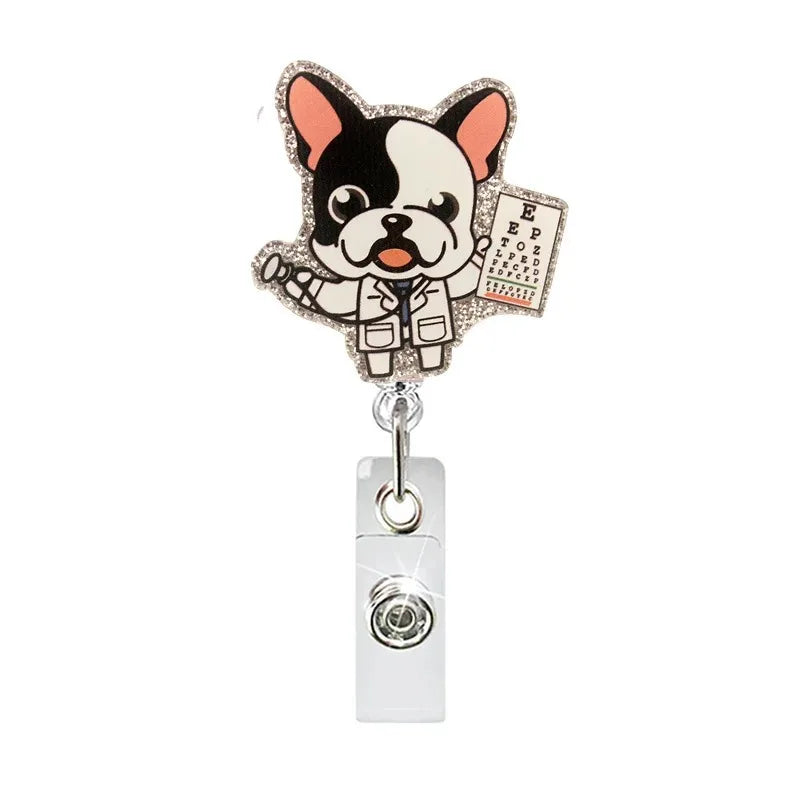 Glitter acrylic badge reel featuring a dog character with black and white fur and orange ears