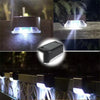 A solar powered LED step light illuminates an outdoor staircase or path.