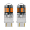 A pair of LED turn signal and reverse light bulbs with clear glass lenses and silver bases.