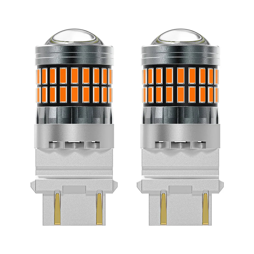 A pair of LED turn signal and reverse light bulbs with clear glass lenses and silver bases.