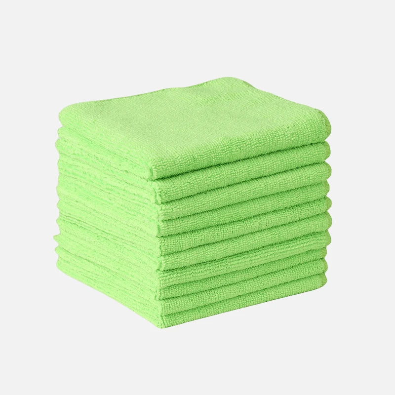 A stack of bright lime green microfiber cleaning towels.
