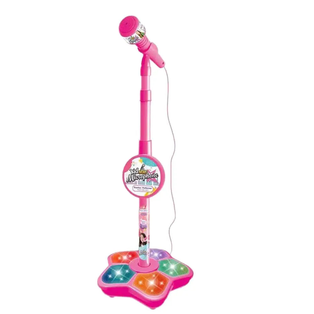 A pink portable karaoke microphone with a stand and light effects.