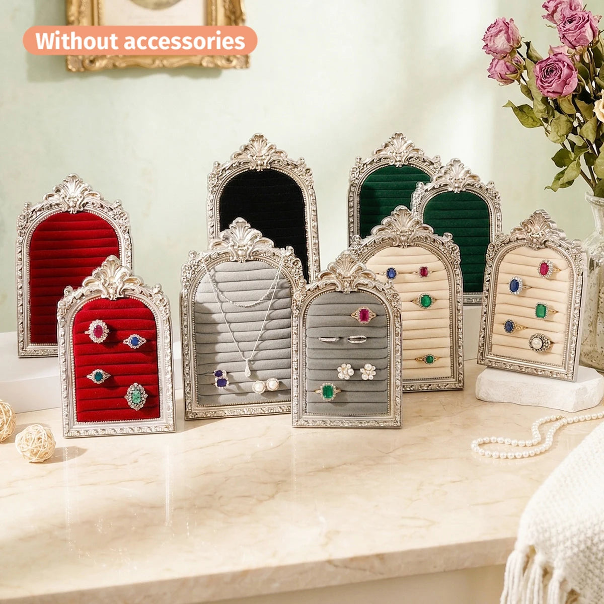 A display of arched resin jewelry stands in various colors and designs, featuring floral patterns.