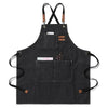 Black cotton canvas apron with cross-back straps and multiple pockets