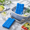 Blue reusable gel ice blocks stacked in a blue cooler with ice and a lime slice.