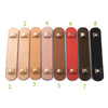 Eight leather handbag handle wraps and shoulder pads in various shades of tan, pink, brown, and black.