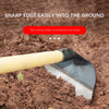 A stainless steel garden hoe is shown with its cutting edge inserted into brown soil.