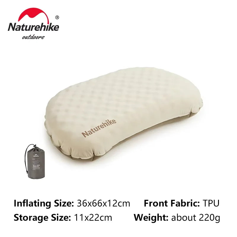 A beige inflatable camping pillow with a storage bag shown next to it.