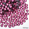 Close-up of pink and magenta rhinestones used for DIY crafts and clothing decoration
