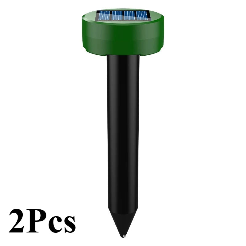 A green and black solar-powered ultrasonic animal repellent device.