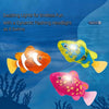 A colorful plastic swimming fish toy with a dynamic flashing headlight is shown against a blue aquatic background.