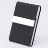 A black textured card holder with a white card slot and a silver edge.