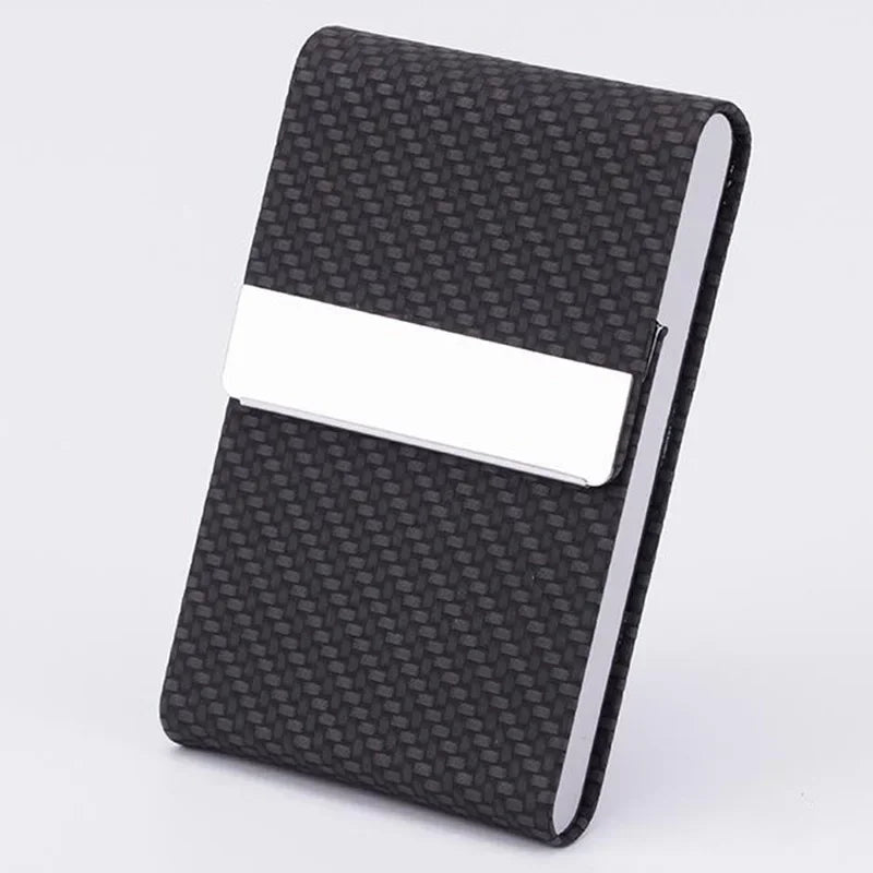 A black textured card holder with a white card slot and a silver edge.