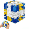 A colorful 3D rolling ball maze cube puzzle toy with blue, yellow, and white components being held by a hand.