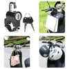 A black electric anti-theft helmet lock is shown mounted on a bicycle handlebar, with a pink bag nearby.
