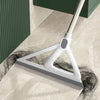 A white silicone squeegee broom is shown cleaning a light-colored floor.