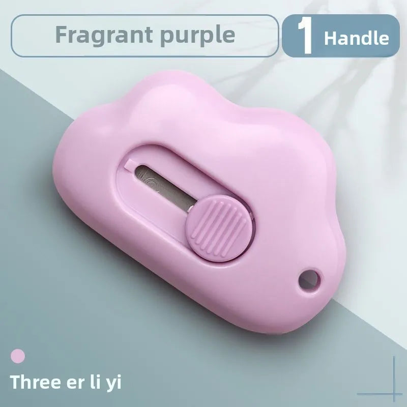 A pink cloud-shaped retractable letter opener with a handle and keychain loop.