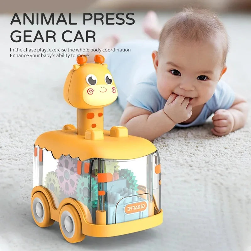 A yellow animal press gear car toy with a light-up giraffe figure is shown next to a baby.