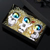Four handcrafted astronaut figurine resin spaceman desk decor figures in a wooden box