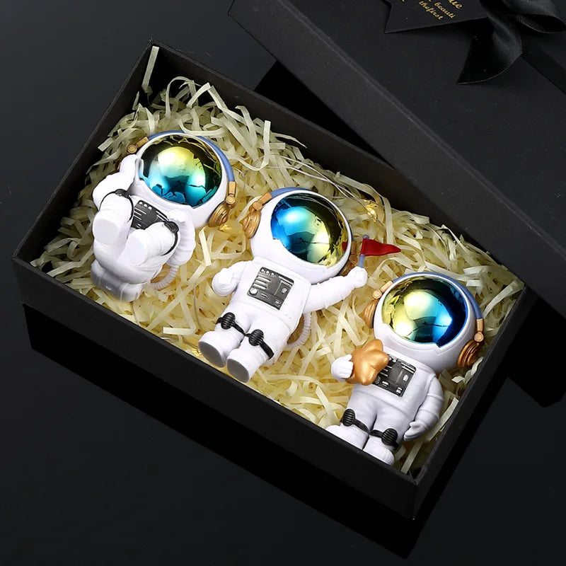 Four handcrafted astronaut figurine resin spaceman desk decor figures in a wooden box