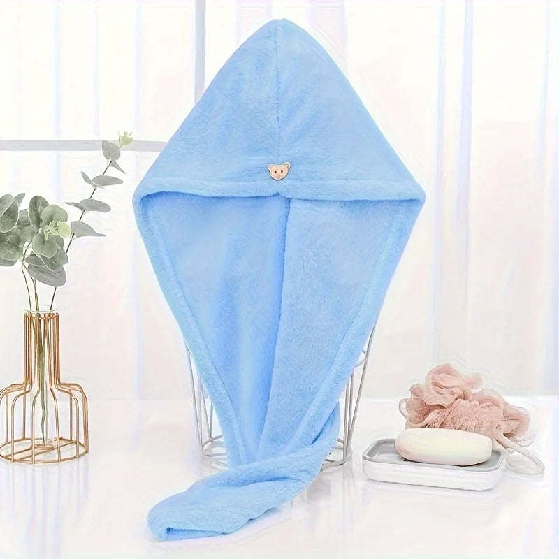 Light blue microfiber towel wrap for hair displayed on a white surface.