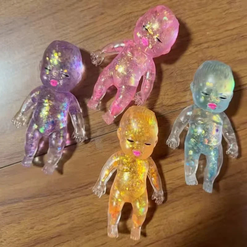 Four squishy stress relief toys in various shades of pink, purple, and yellow with a shimmer finish