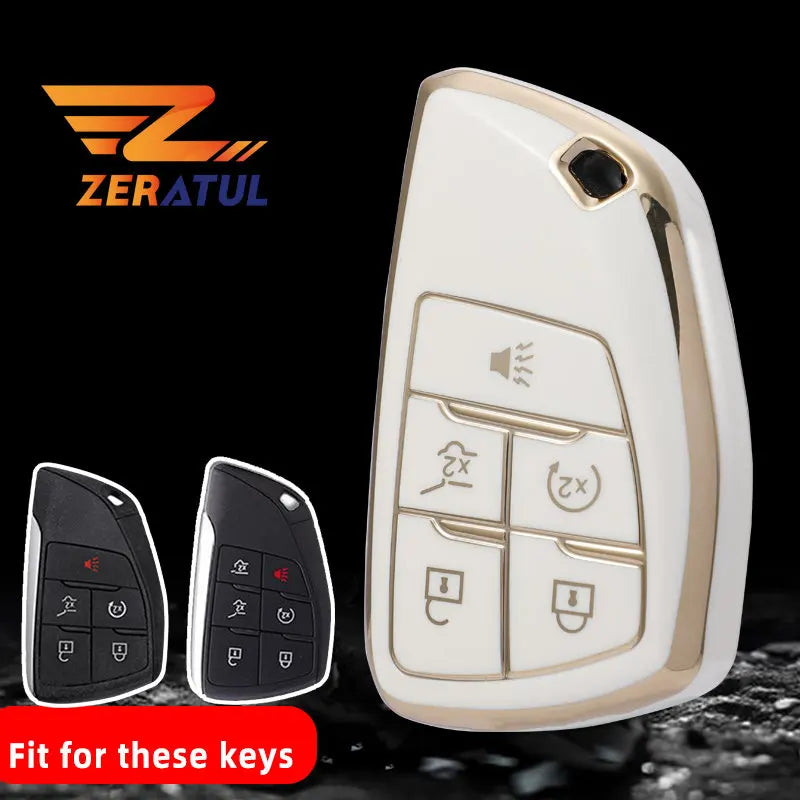 A white car key fob cover is shown next to two black key fobs on a dark surface.