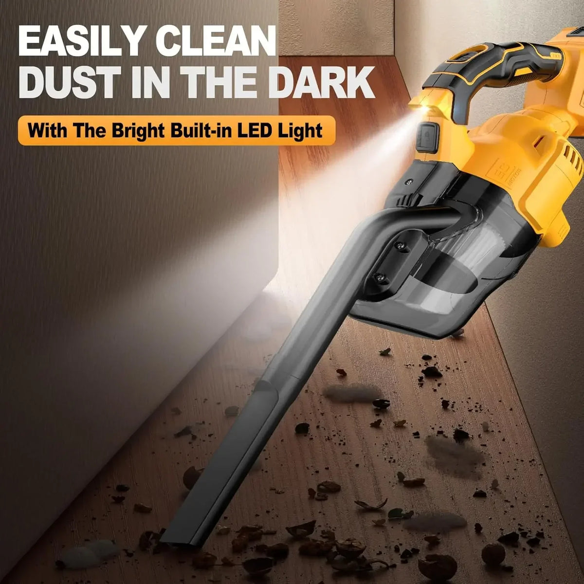 A yellow cordless handheld vacuum cleaner illuminates dust in a dark area with a bright built-in LED light.