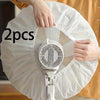 Hands are placing a white dust cover for an electric fan onto the fan grille.