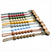 A display of food-grade silicone pacifier clips with anti-lost chains in various colors and wood accents.