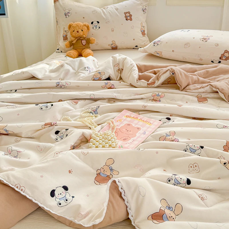 A beige and pink patterned duvet cover with a lace trim is displayed on a bed.