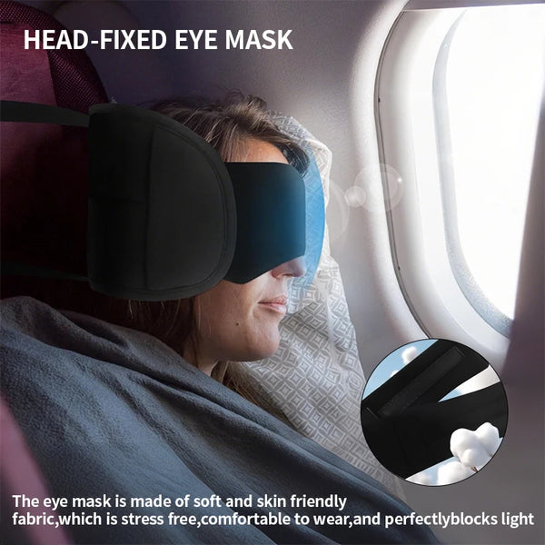 Una mujer lleva una máscara de ojos fija en un asiento de avión, bloqueando la luz.