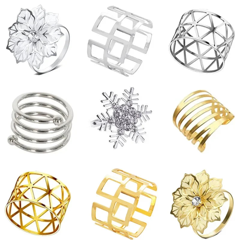 A collection of twelve decorative metal napkin rings featuring various geometric and floral patterns in silver and gold finis