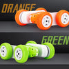 A remote control stunt car with orange wheels and a green version, shown in a side view.