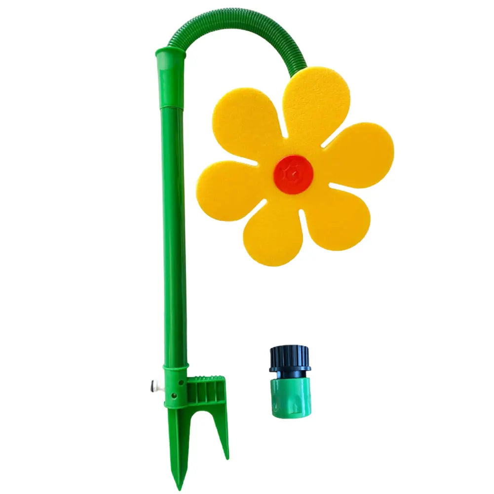 Un arroseur de jardin vert avec une tête florale rotative et une buse verte.
