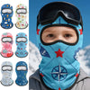 A close-up of a blue kids winter balaclava mask featuring various colorful patterns and a star design.