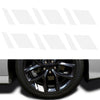 A close-up view of a black wheel hub with a reflective sticker set installed on the center cap.