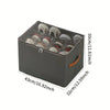 A dark gray foldable shoe organizer with a dustproof lid showing multiple pairs of shoes.
