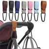A set of colorful PU leather baby bag organizers with hooks shown next to a stroller handle.