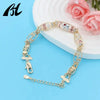 Symbolic Charm Bracelet with Elephant, Horseshoe & Evil Eye Pendants