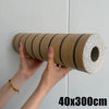 Roll of self-adhesive wood grain wall panels in brown for accent walls and ceilings