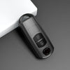 A close-up view of a black TPU car key cover resting on a white surface.