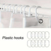 A set of white plastic hooks used for hanging bathroom accessories.